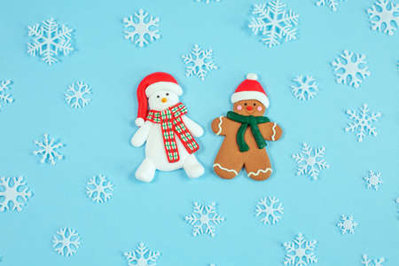 Christmas cookies, snowman and gingerbread and snowflakes on blue background.の写真素材