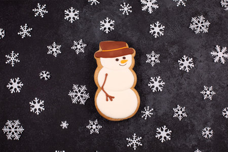 Holiday Gingerbread snowman decorated with white icing and snowflakes