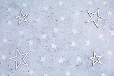 White stars different sizes on a gray background.の写真素材