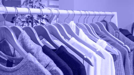 Violet knitwear warm cloth on wooden hangers.の写真素材