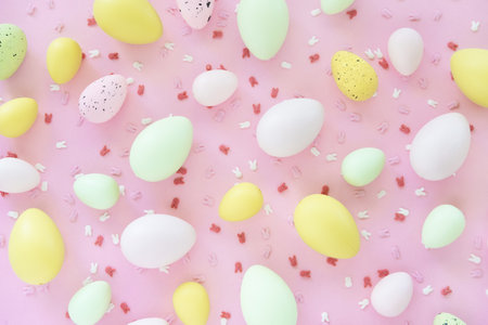 Colorful Easter eggs on pink background. Egg hunting.の写真素材
