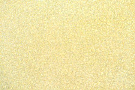 Light yellow glitter texture abstract backgroundの写真素材