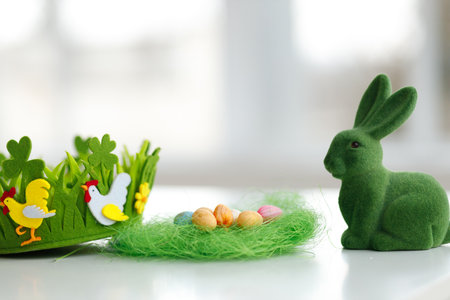 Easter eggs. Chicken eggs, twigs with green leaves on the hay. Easter holiday concept background. copy spaceの写真素材
