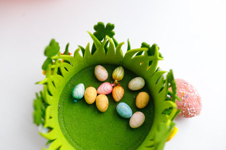 Easter toys. Easter toys in a decorative basket. white background.の写真素材