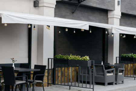 Open empty coffee. Restaurant terrace with tables and chairs. Plants on the terrace of the restaurant.の写真素材