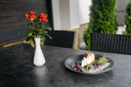 Classic simple New York cheesecake. A piece of cheesecake on a plate. Dessert with berries and chocolate. dark background. front view. copyspace.の写真素材