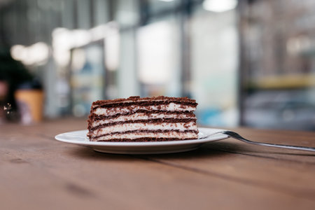 Cake on a plate. Delicious cake on a cafe background.の写真素材
