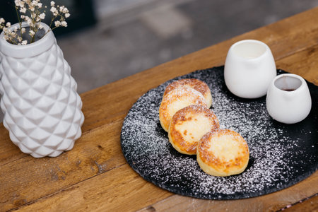 Cheese pancakes, homemade traditional Ukrainian and Russian matches, selective focus. Cheesecakes on a plate.の写真素材