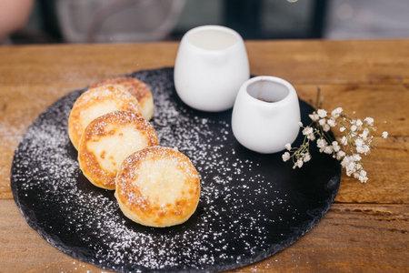 Cheese pancakes, homemade traditional Ukrainian and Russian matches, selective focus. Cheesecakes on...