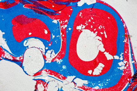 Spots of marble paint in the colors of the Russian flag