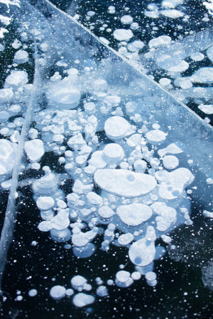 Gas bubbles in ice of Baikal lake. Winter texture