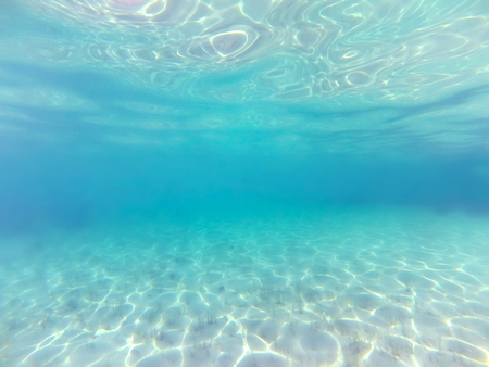 Underwater blurred background. Blue transparent sea waterの写真素材