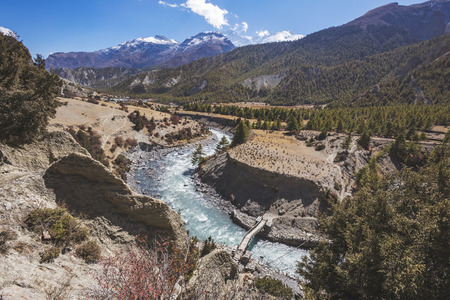 Bridge over Marsyandi River near Bhakra village. Nepalese Himalayasの写真素材
