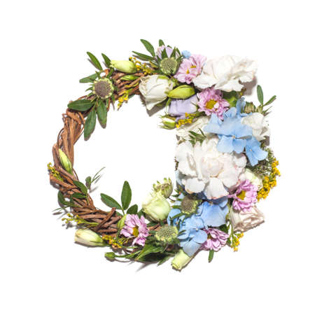 Wreath of defferent flowers isolated on a white backgroundの写真素材