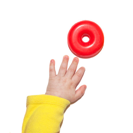Child's hand reaches for toys. Baby palm isolated on white backgroundの写真素材