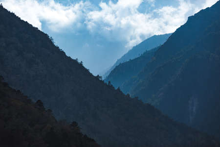 Wooded mountainsides landscape. Himalayan Mountains of Nepal.の写真素材