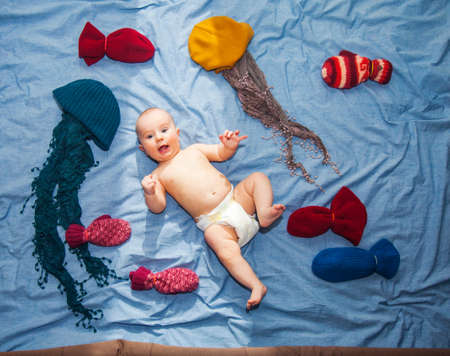 Baby boy in a fairy tale. Underwater worldの写真素材