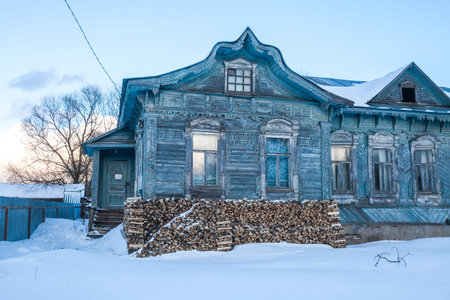 Blue house with wooden carvings in Porechye, Kalyazinsky district, Tver region, Russiaの写真素材