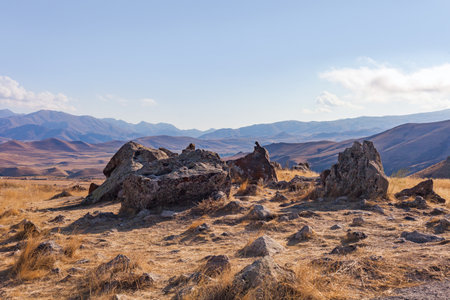 Standing stones in Zorats-Karer or Karahunj. Ancient megalithic complex, on a mountain plateau at an altitude of 1770 meters above sea level, Syunik region of Armenia. Historical and cultural reserveの写真素材