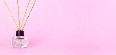 Air freshener and aromatherapy concept. Air freshener on blank clean pink banner backgroundの写真素材