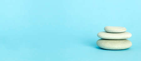 Zen background blue color with Japanese stone towers for spa, meditation and relaxationの写真素材