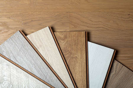 Laminate background. Samples of laminate or parquet with a pattern and wood texture for flooring and interior design. Production of wooden floors.の写真素材
