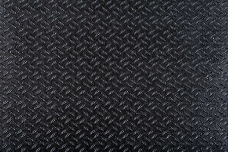 Rubber background. Black rubber grooved surface with background tread patternの写真素材