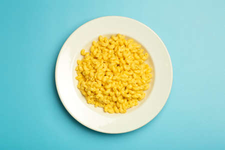 Pasta background.  pasta on a blue background. American style Italian pasta with cheese.の写真素材