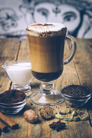 SPICE DIRTY CHAI LATTE. Masala chai and espresso. Autumn or winter warm spice coffee drinkの写真素材