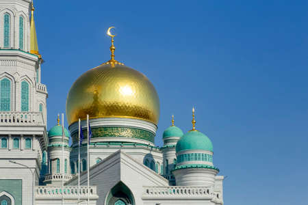 Islamic mosque on a blue sky background. The main cathedral mosque of Muslims in Moscow Russia. Islam, ramadan conceptの写真素材