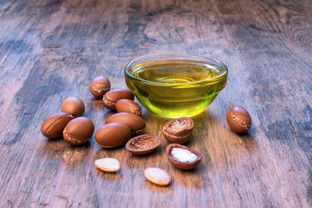 ARGAN SEEDS on a wodden background. Argan oil and argan conceptの写真素材