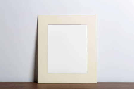 Mock up empty white frame background. Empty frame for a photo or painting in a light Scandinavian minimalist interior on a white clean wall. High qualityの写真素材
