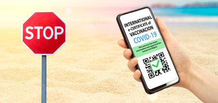 Coronavirus vaccination certificate or vaccine passport for travellers concept. COVID-19 immunity e-passport in the smartphone mobile app for international travelling. Summer travel beach backgroundの写真素材