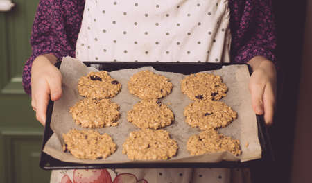 Cooking homemade oatmeal cookies from natural plant ingredients. Cooking stage, veg conceptの写真素材