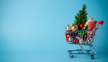 Christmas tree with decorations in a supermarket cart. Christmas shopping and sale conceptの写真素材