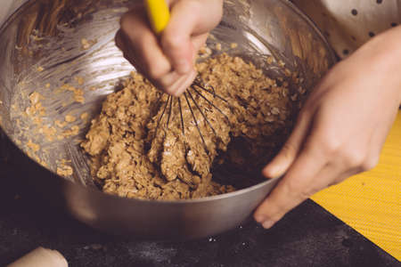 Cooking homemade oatmeal cookies from natural plant ingredients. Cooking stage, veg concept.の写真素材