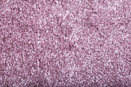 Carpet covering background. Pattern and texture of pink colour carpet. Copy space.