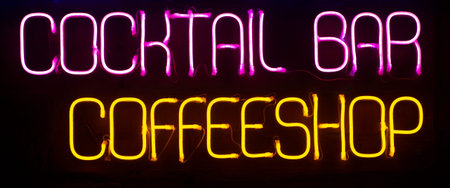 Neon background. Neon COFFEESHOP signs and words of different colors at night on the street. Electric color lighting for fashion and beauty designの写真素材