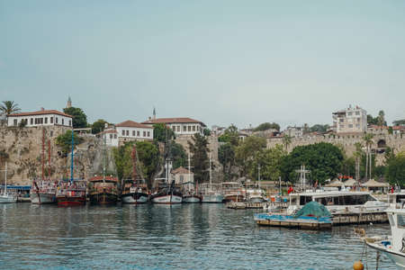 Antalya, Turkey - 30 July 2021: Panorama of the beautiful port of the old town of Kaleici in Antalya. Yachts, cruise boats and ships docked in the Mediterranean. Sightseeing, tourism, rest and travel in Turkey. high quality photoの写真素材