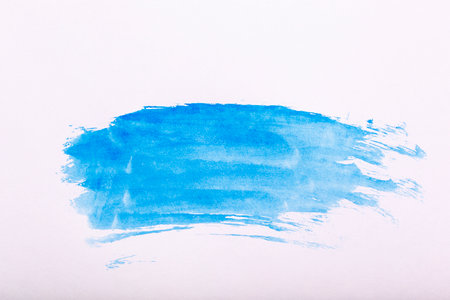 watercolor background. Blue brush strokes of watercolor paint on white paper. high quality photoの写真素材