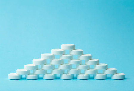 Pills background. Pills, drags and medecine concept. White tablets on a blue background