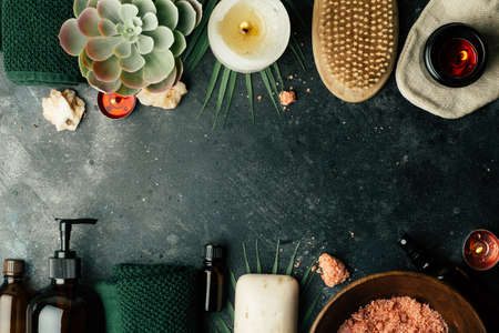 Spa background concept. Oil herb cosmetic, parfume and aroma salt for aromatherapy, massage, shower and relaxの写真素材