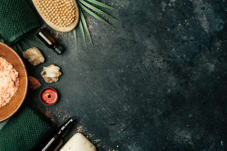 Spa background concept. Oil herb cosmetic, parfume and aroma salt for aromatherapy, massage, shower and relaxの写真素材