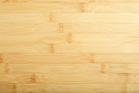 Bamboo background. Treated bamboo wood surface for countertops, furniture and tableware.