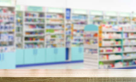 Pharmacy table background. Blur counters of pharmacy with medicines, tablets and pills.の写真素材