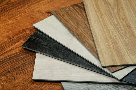 Laminate background. Samples of laminate or parquet with a pattern and wood texture for flooring and interior design. Production of wooden floorsの写真素材