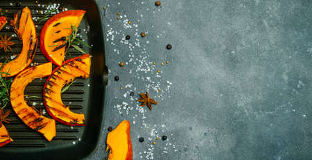 Grilled and baked pumpkin banner. Autumn harvest of vegetables and pumpkin dishes.の写真素材