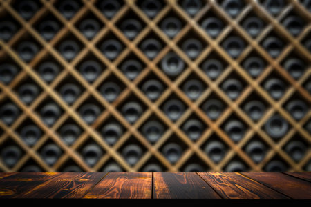 Wine wooden table background. Wine cellar with blurred bottles and wooden rustic tableの写真素材