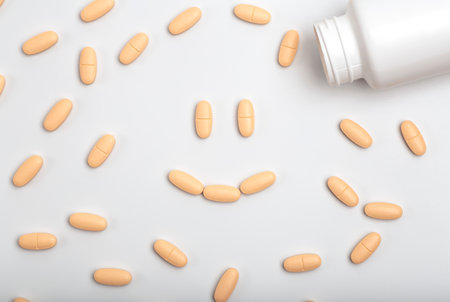 Pharmacy market drugstore concept. Antidepressants, pills and vitamins with a jar on a blank minimal background. Medicines, antibiotics, dietary supplements, multivitamins concept.の写真素材