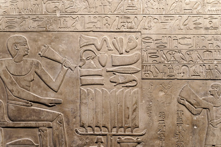 Egyptian hieroglyphs and ancient drawings on clay tablets and papyri background. The art of Egypt...